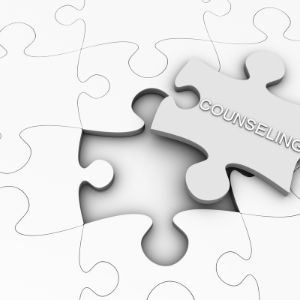 White Jigsaw puzzle with one piece taken out. That piece has the word 'counselling' written on it. 